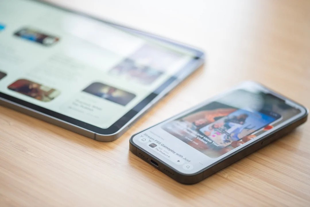 A contemporary workspace showcasing a laptop, tablet, and smartphones, ideal for tech and freelance use.